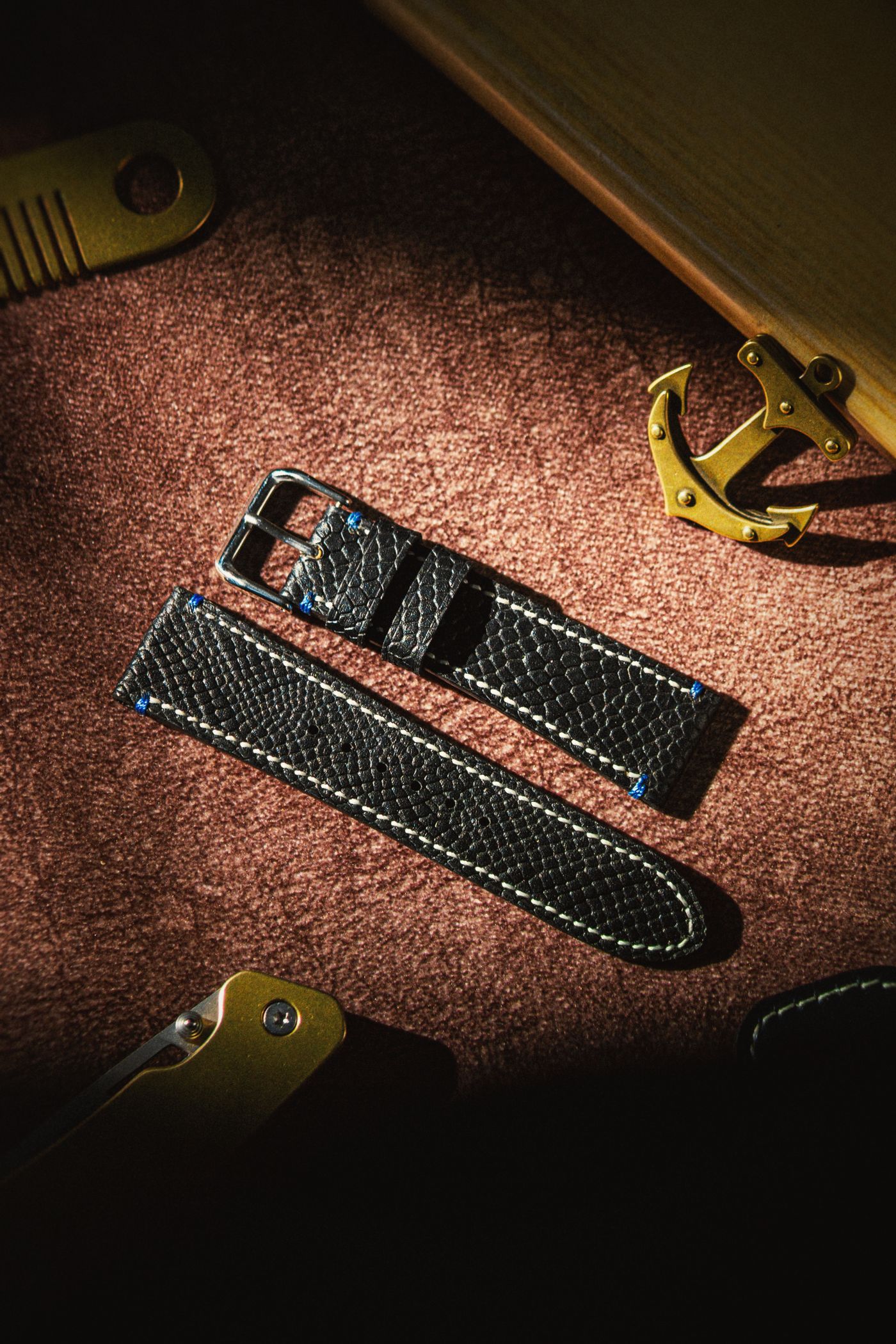 A pair of black replacement leather watch strap pieces